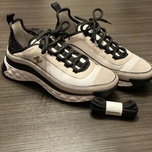 CHANEL Black and Cream Lace-Up Sneakers